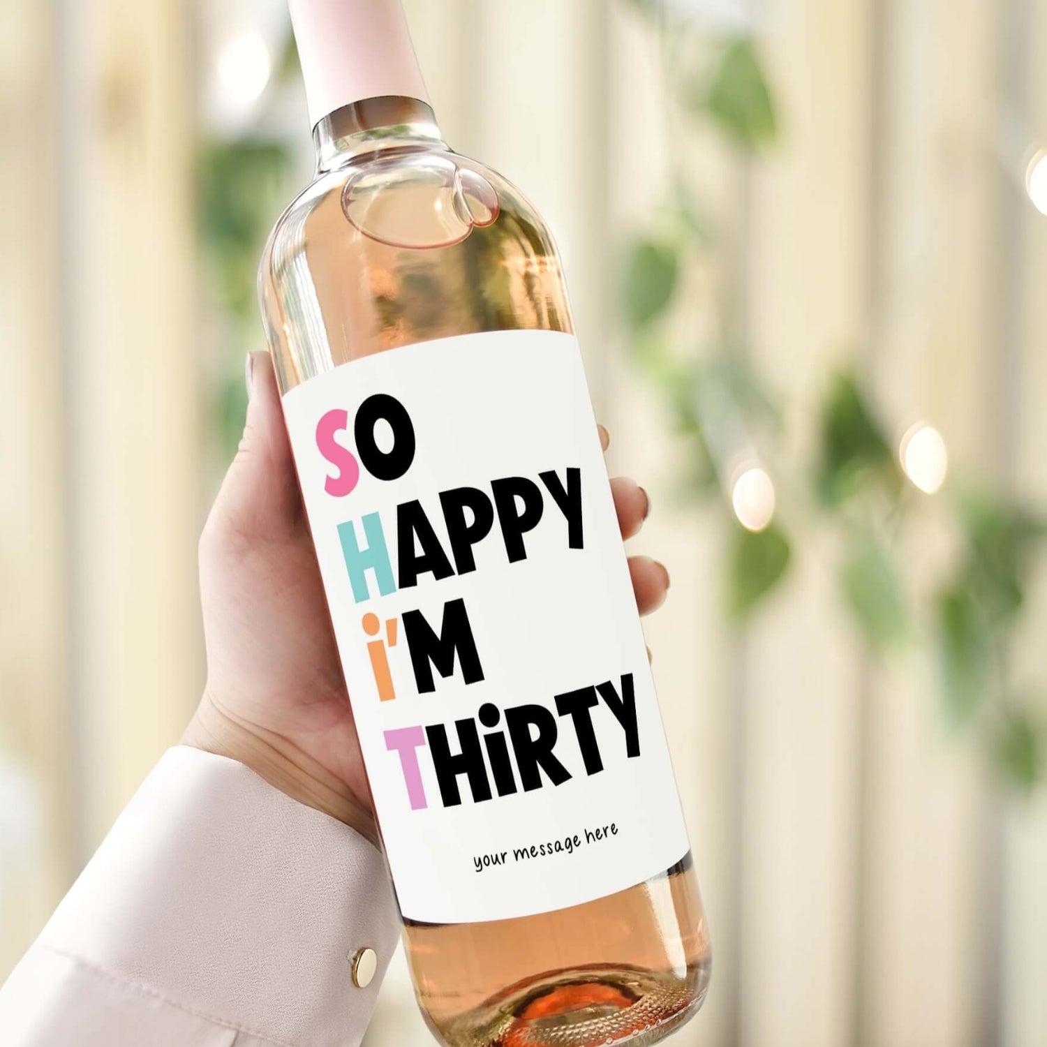 A wine bottle with a funny 30th birthday label reading "So Happy I'm Thirty," perfect for gifting to best friends or sisters.