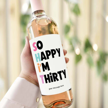 A wine bottle with a funny 30th birthday label reading "So Happy I'm Thirty," perfect for gifting to best friends or sisters.
