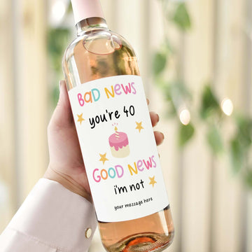 A funny 40th birthday wine label reading "Bad News, You’re 40; Good News, I’m Not," perfect as a humorous custom gift.

