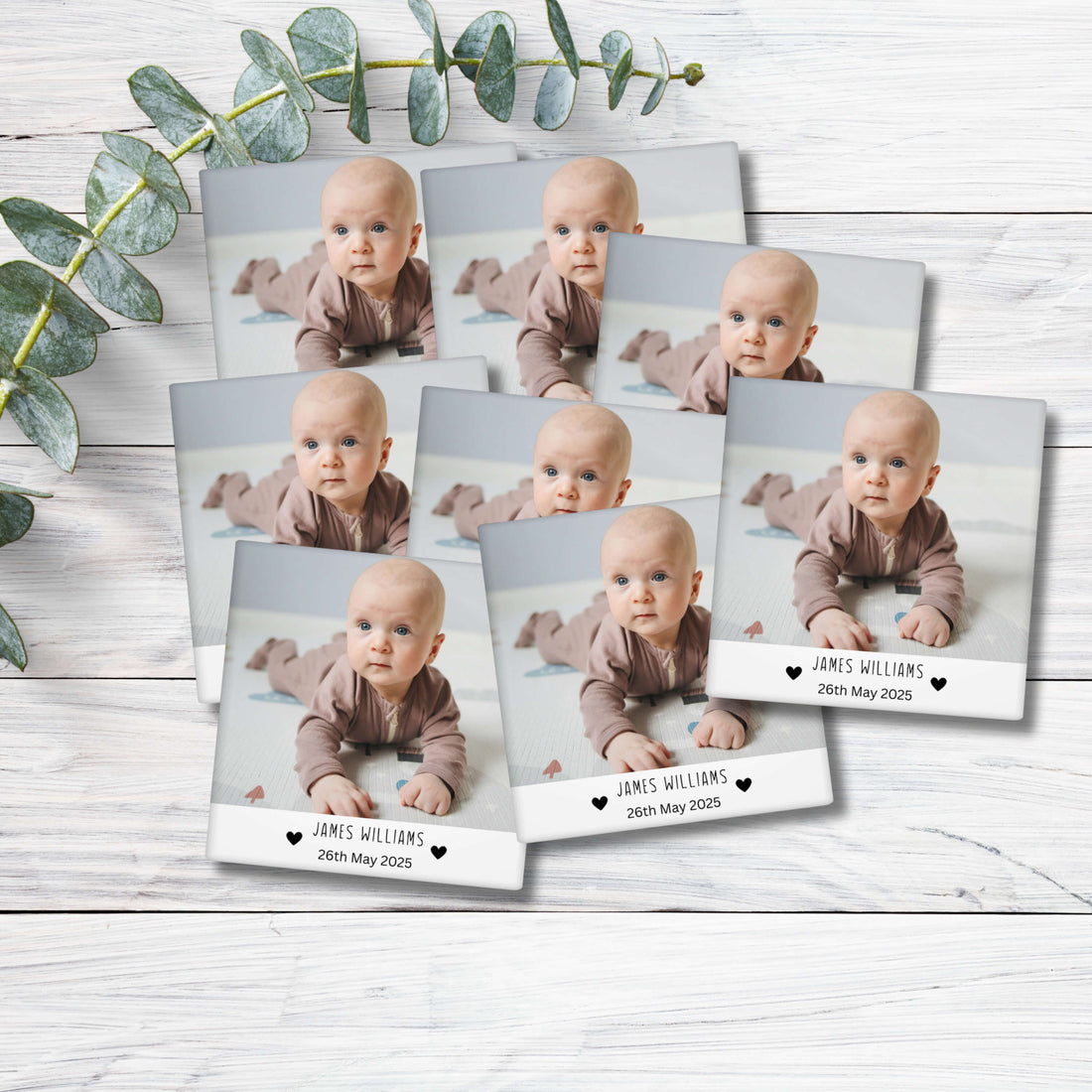 Square magnet with a photo of a baby and text on a metallic surface