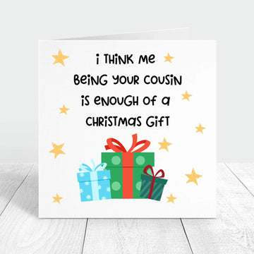 Funny Christmas card with the message "I think me being your cousin is enough of a Christmas gift," decorated with colourful presents and stars, perfect for a lighthearted holiday greeting.