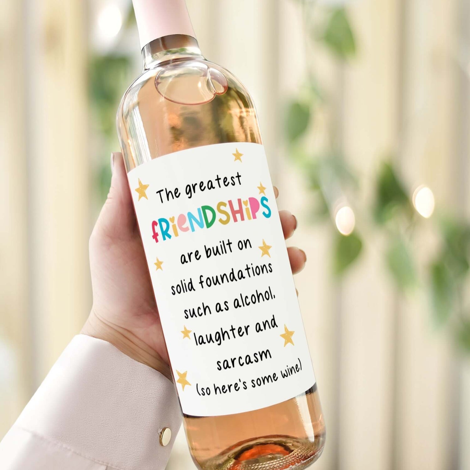 Funny custom wine label for a best friend’s birthday, reading "The greatest friendships are built on alcohol, laughter, and sarcasm."