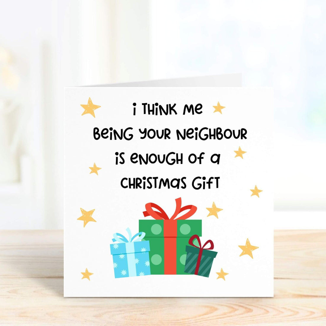 Funny Christmas card with the message, "I think me being your neighbour is enough of a Christmas gift," decorated with gift boxes and stars. Perfect for sharing a laugh this festive season.