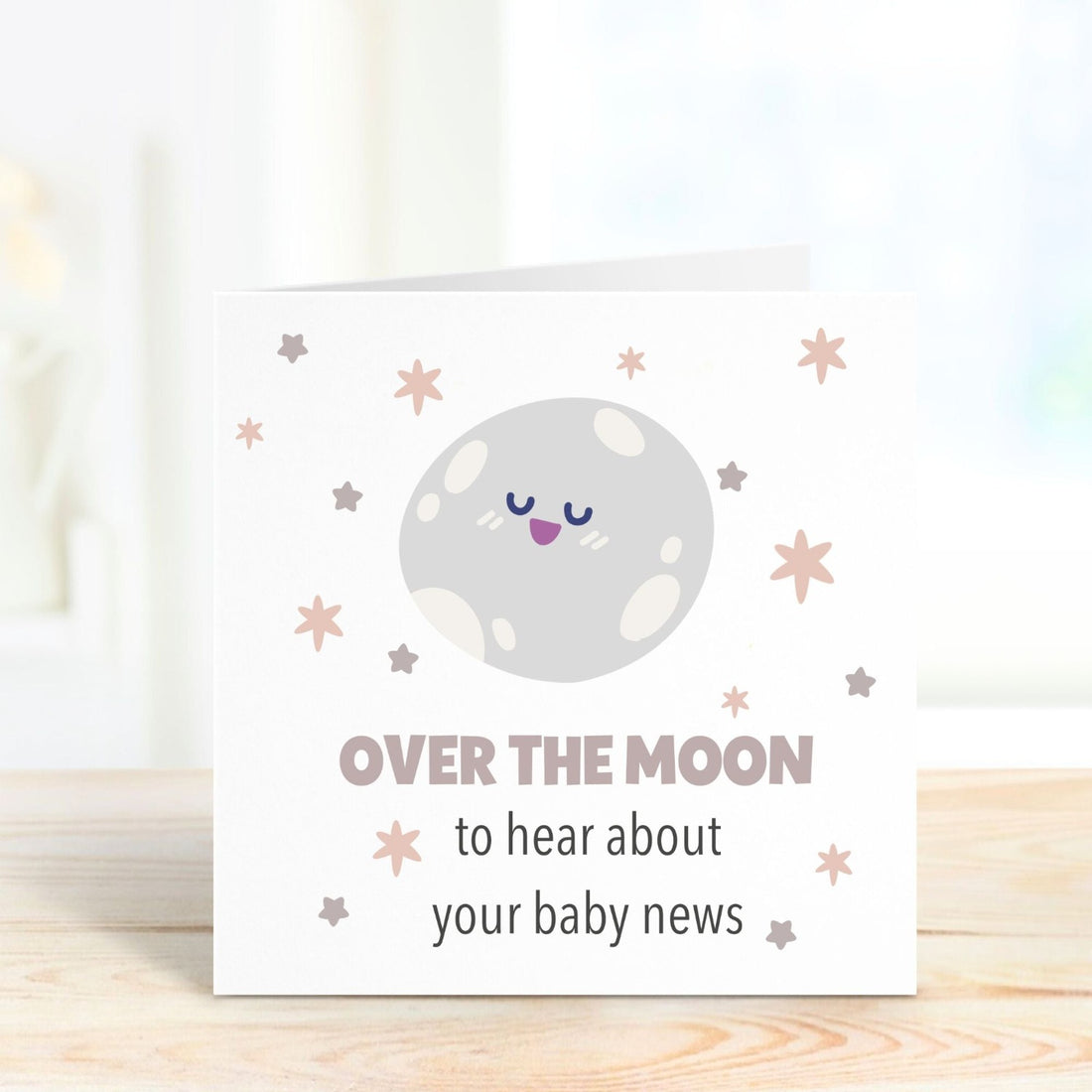 over the moon to hear about your baby news personalised card