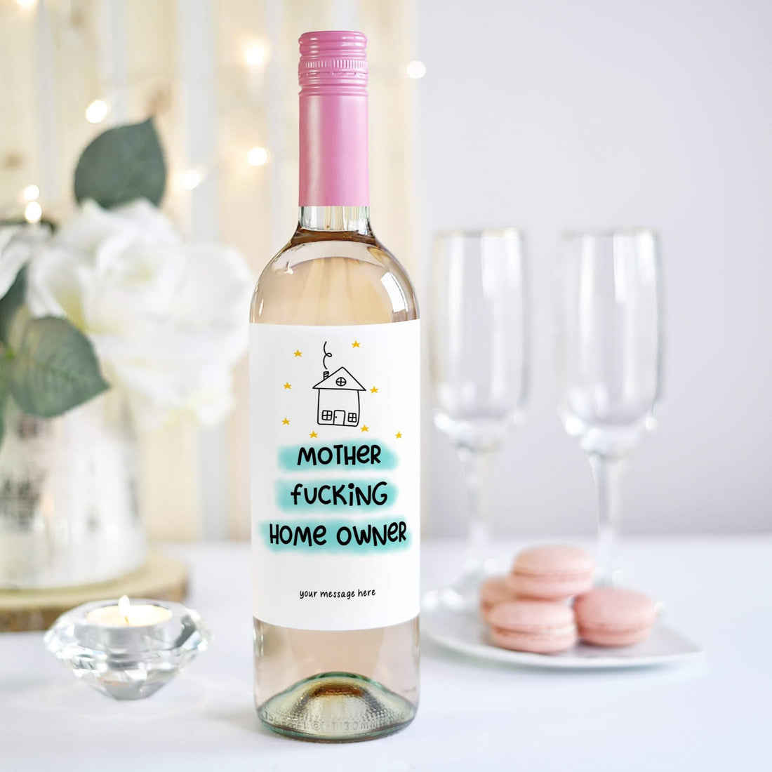 A wine bottle with a funny housewarming label reading "Mother F***ing Home Owner," designed as a gift for celebrating new homeowners.
