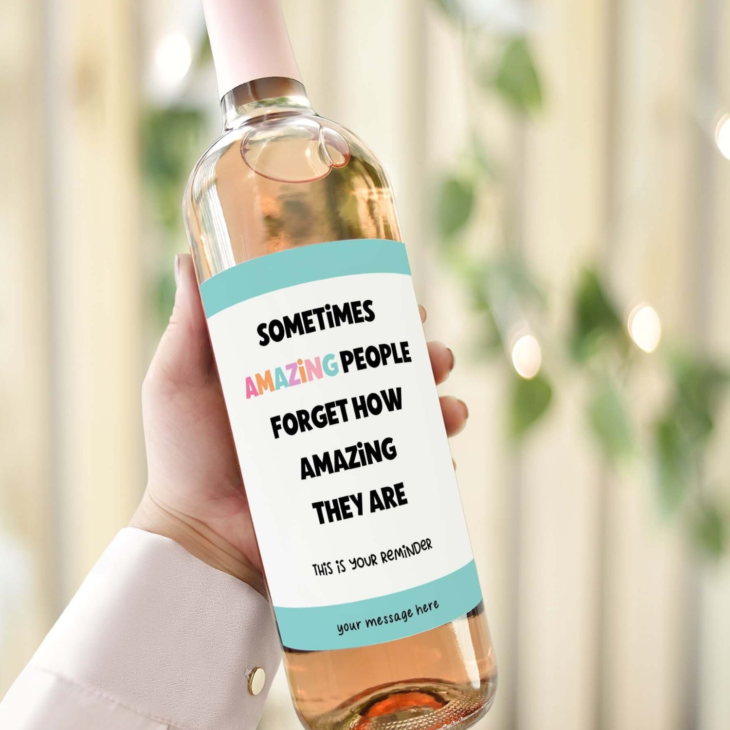 A wine bottle with a thank you label reading "Sometimes amazing people forget how amazing they are. This is your reminder," ideal for an appreciation gift.