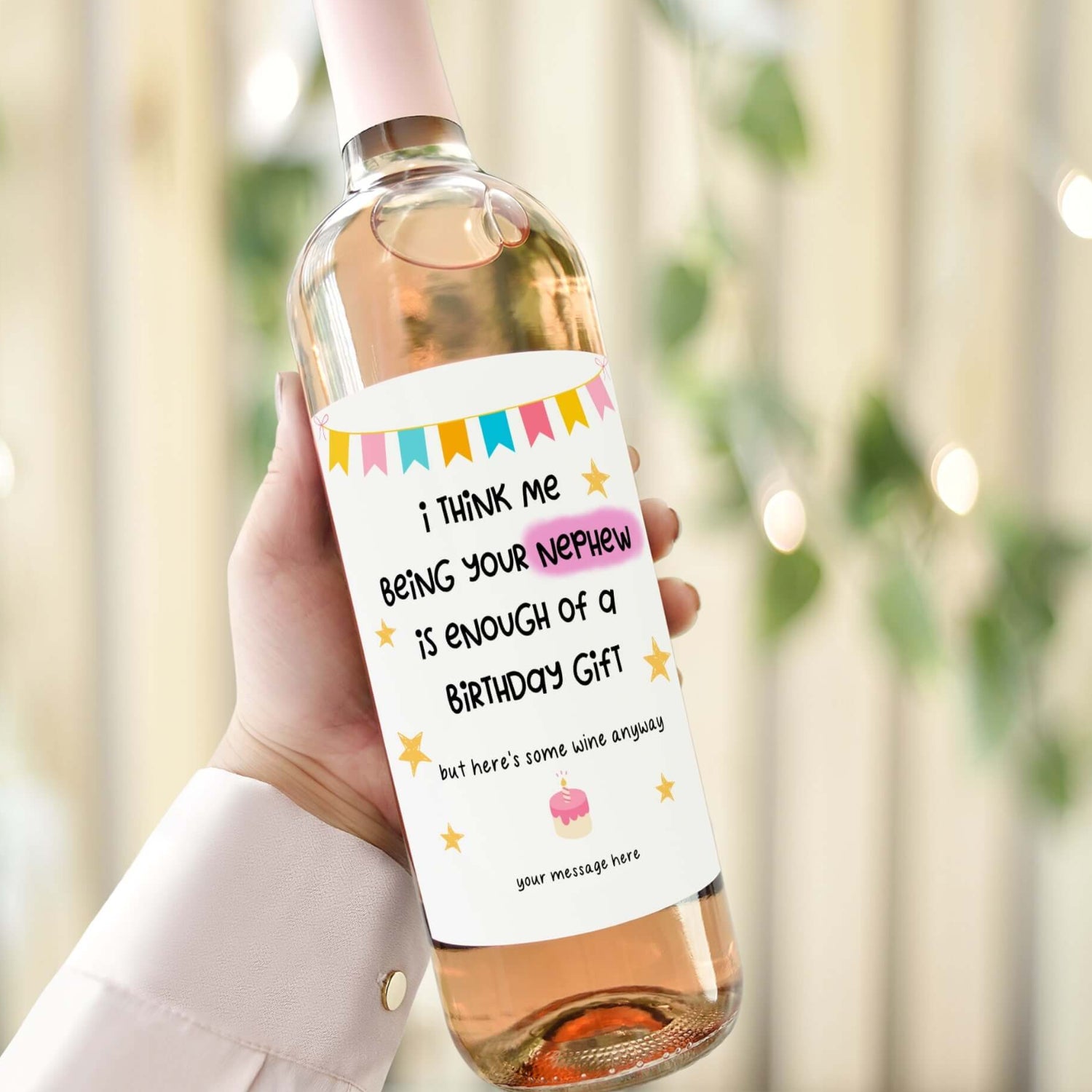 A wine bottle with a birthday label reading "I think me being your nephew is enough of a birthday gift, but here’s some wine anyway."